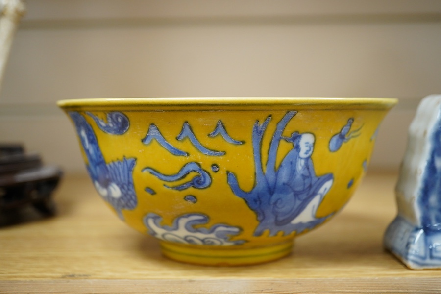 A Chinese blue and white brush holder and a yellow ground bowl, 16cm diameter, Condition - good